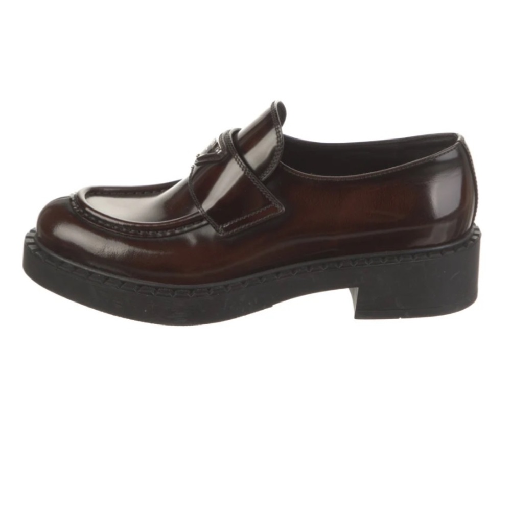 Prada Enameled Metal Triangle Leather Loafers
Women's Size 9.5 39.5 brown